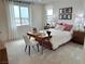 Bright bedroom features a large window, a work desk, neutral decor, and comfortable furnishings at 929 Hunter Shores Ave, North Las Vegas, NV 89084