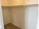 Walk-in closet features basic shelving, plenty of space for hanging clothes, and a neutral color palette at 929 Hunter Shores Ave, North Las Vegas, NV 89084