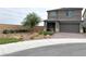 Charming two-story home with desert landscaping and a covered porch at 929 Hunter Shores Ave, North Las Vegas, NV 89084