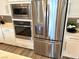 Stainless steel refrigerator, oven, and microwave in a modern kitchen setting at 929 Hunter Shores Ave, North Las Vegas, NV 89084