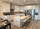 Bright kitchen featuring white cabinets, a large center island, and modern appliances at 929 Hunter Shores Ave, North Las Vegas, NV 89084