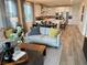 The open concept living space features a seating area open to the dining room and a modern kitchen at 929 Hunter Shores Ave, North Las Vegas, NV 89084