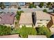 Aerial view of neighborhood featuring multiple homes, streets and desert landscaping at 9823 Belle Marie Ct, Las Vegas, NV 89141