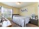 Inviting bedroom with a comfortable bed, natural light, and a peaceful ambiance for a good night's sleep at 9823 Belle Marie Ct, Las Vegas, NV 89141