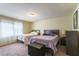 Comfortable bedroom featuring twin beds, soft natural light, and neutral tones, perfect for a relaxing stay at 9823 Belle Marie Ct, Las Vegas, NV 89141