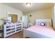 Bright bedroom with mirrored dresser, large window and carpet flooring at 9823 Belle Marie Ct, Las Vegas, NV 89141