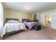 Bright bedroom featuring comfortable twin beds, soft lighting, and easy access to the upstairs hallway at 9823 Belle Marie Ct, Las Vegas, NV 89141