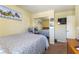 Bright bedroom featuring a comfortable bed, soft lighting, and a mirrored closet for an airy feel at 9823 Belle Marie Ct, Las Vegas, NV 89141