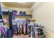 Walk-in closet with ample shelving and hanging space, perfect for organizing clothes and accessories efficiently at 9823 Belle Marie Ct, Las Vegas, NV 89141