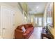 Inviting living area with tile flooring, a staircase, and a comfortable sofa at 9823 Belle Marie Ct, Las Vegas, NV 89141
