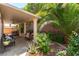 Inviting covered patio with desert landscaping and plenty of space for seating and entertaining at 9823 Belle Marie Ct, Las Vegas, NV 89141