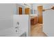 This bathroom shows a bathtub with white tile and a view of the double sink vanity at , Henderson, NV 89011