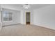 Spacious bedroom featuring a ceiling fan, neutral-colored carpet, and a walk-in closet at , Henderson, NV 89011