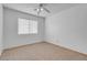 The bedroom features a ceiling fan and a window that provides natural light at , Henderson, NV 89011