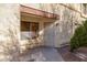 Inviting front entryway features a secure metal security gate and small shrub at , Henderson, NV 89011