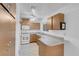 Bright kitchen with white appliances and oak cabinets, plus breakfast bar seating at , Henderson, NV 89011