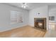 Bright living room features a cozy fireplace and ample natural light from the large window at , Henderson, NV 89011