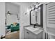 Cozy bathroom with modern vanity, neutral colors, and sleek black fixtures at 1025 Willow Tree Dr # B, Las Vegas, NV 89128