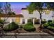 Charming two-story home with beautiful landscaping at dusk at 1025 Willow Tree Dr # B, Las Vegas, NV 89128