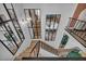View of the second floor showcasing the stairs, open living space, and modern railings at 1025 Willow Tree Dr # B, Las Vegas, NV 89128