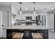 Bright kitchen features stainless steel appliances, quartz counters, and modern pendant lighting at 1025 Willow Tree Dr # B, Las Vegas, NV 89128