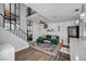 Bright and airy living room with stairs, contemporary decor and wood-look floors at 1025 Willow Tree Dr # B, Las Vegas, NV 89128