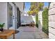 Private outdoor patio featuring modern seating area, stylish rug, and decorative wall at 1025 Willow Tree Dr # B, Las Vegas, NV 89128