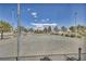 Fenced tennis court on a sunny day, perfect for recreational play and community engagement at 1025 Willow Tree Dr # B, Las Vegas, NV 89128