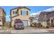 Charming two-story home featuring a neatly paved driveway, a well-maintained lawn, and an attached two-car garage at 1168 Aspen Cliff Dr, Henderson, NV 89011