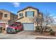 Charming two-story home featuring a neatly paved driveway, a well-maintained lawn, and an attached two-car garage at 1168 Aspen Cliff Dr, Henderson, NV 89011