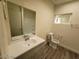 Bathroom with vanity, toilet, and shower-tub combo at 1317 Exley Ave, Las Vegas, NV 89104