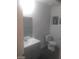 A well-lit bathroom with sleek flooring, modern fixtures, and a stylish vanity at 1317 Exley Ave, Las Vegas, NV 89104