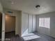 This bedroom has plank flooring, a window with blinds, a closet, and a ceiling light at 1317 Exley Ave, Las Vegas, NV 89104