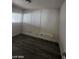 Bedroom with wood-look floors and natural light at 1317 Exley Ave, Las Vegas, NV 89104