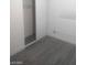 A bright bedroom features plank floors, a closet, and a window with horizontal blinds at 1317 Exley Ave, Las Vegas, NV 89104