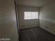 The bedroom offers plank floors, a closet with sliding doors, and a window with blinds at 1317 Exley Ave, Las Vegas, NV 89104
