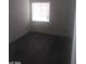 Small bedroom with wood-look floors and natural light at 1317 Exley Ave, Las Vegas, NV 89104