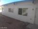 Exterior view showing the side and back of the home with windows at 1317 Exley Ave, Las Vegas, NV 89104