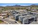 A high angle image of modern townhouses in a landscaped community with mountain views at 143 Aqua Commons Ln, Henderson, NV 89015