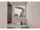 Charming balcony with red door and neutral tones at 143 Aqua Commons Ln, Henderson, NV 89015