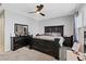 Bedroom featuring a dark wood bedroom set, a ceiling fan, and neutral paint at 143 Aqua Commons Ln, Henderson, NV 89015