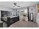 Bedroom featuring a dark wood bedroom set, a ceiling fan, and neutral paint at 143 Aqua Commons Ln, Henderson, NV 89015