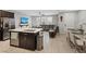 Open-concept living space with tile flooring, recessed lighting, and modern furnishings at 143 Aqua Commons Ln, Henderson, NV 89015
