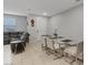 Inviting living room with comfortable seating, bright dining area, and neutral decor that complements the open space at 143 Aqua Commons Ln, Henderson, NV 89015