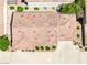 An aerial view showing the tile roof, landscaping, and driveway of the home at 1440 Summer Glow Ave, Henderson, NV 89012