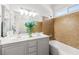 Bright bathroom features double sinks, a tile backsplash, and a shower-tub combination at 1440 Summer Glow Ave, Henderson, NV 89012
