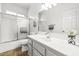 Bright bathroom with a sliding glass shower door and tile flooring at 1440 Summer Glow Ave, Henderson, NV 89012