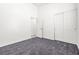 Bright bedroom boasts new carpet and neutral paint, with ample closet space at 1440 Summer Glow Ave, Henderson, NV 89012