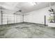 A large garage with an automatic door, ample room, and water heater at 1440 Summer Glow Ave, Henderson, NV 89012