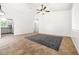 Bright living room features neutral tile flooring, modern ceiling fan, and ample natural light at 1440 Summer Glow Ave, Henderson, NV 89012